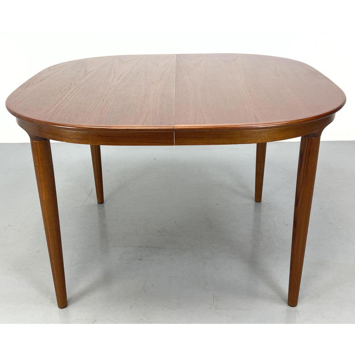 Danish teak dining table with rounded