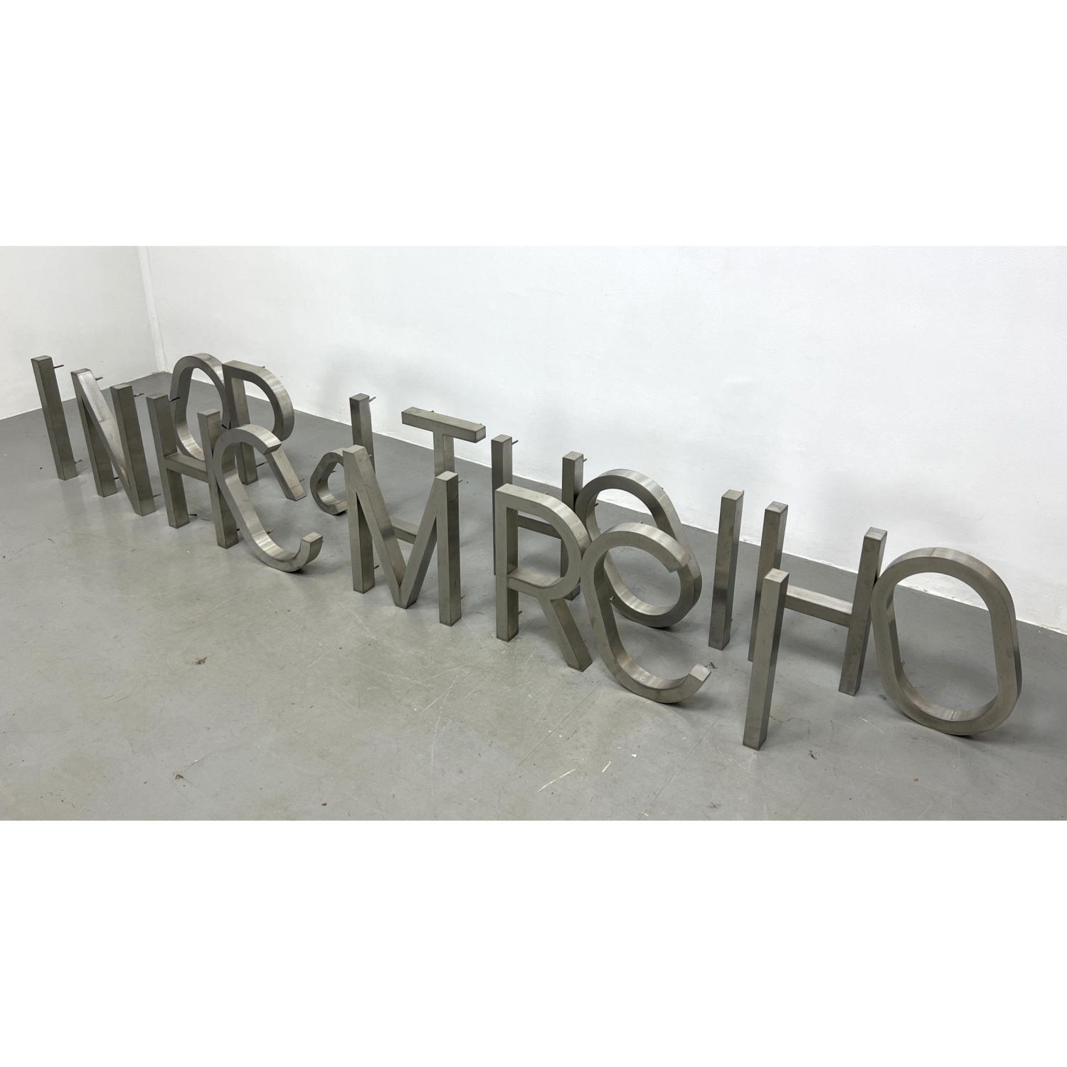 Lot of 18 Metal Mountable Letters.