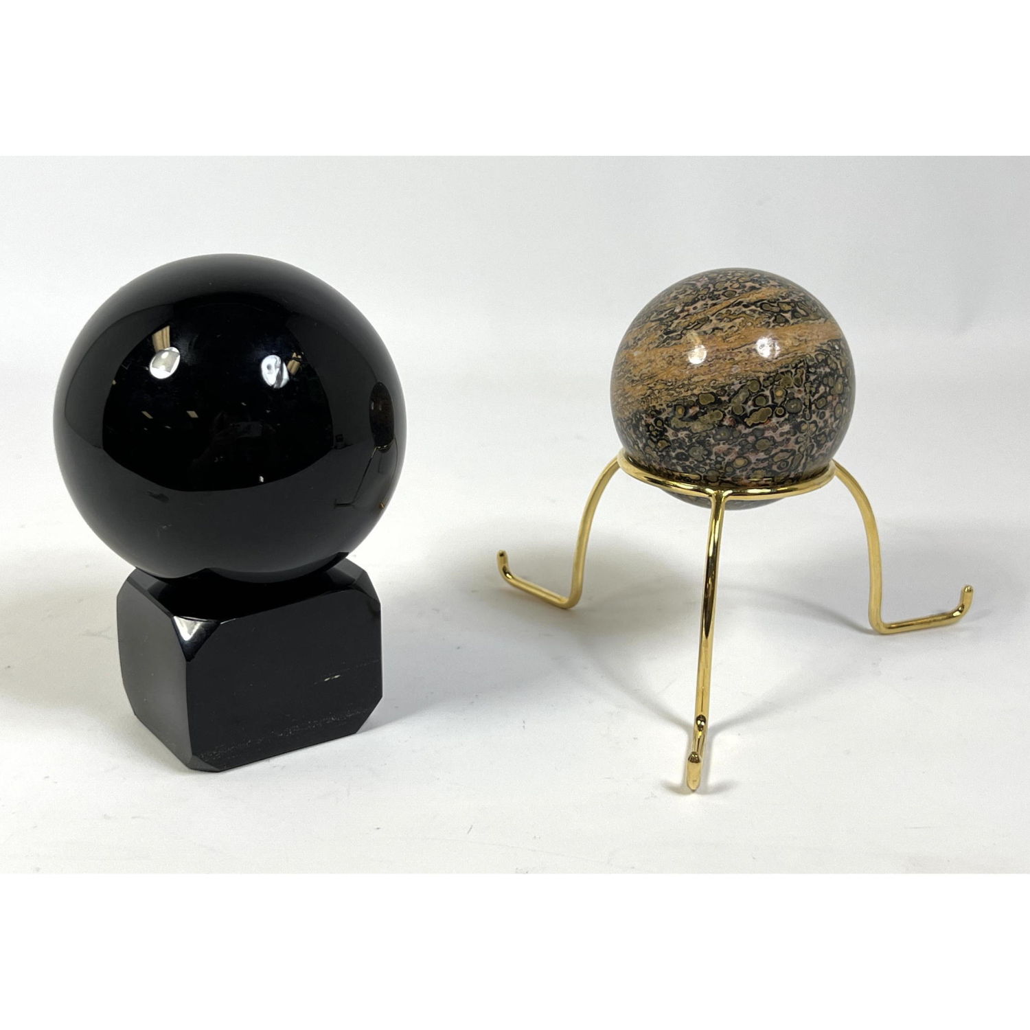 Two Polished Stone Spheres on Stands  2b8a56