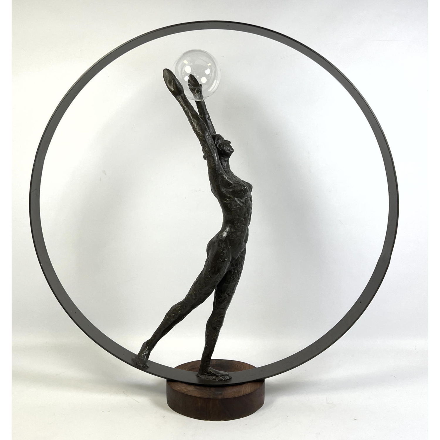 Female nude with glass ball and