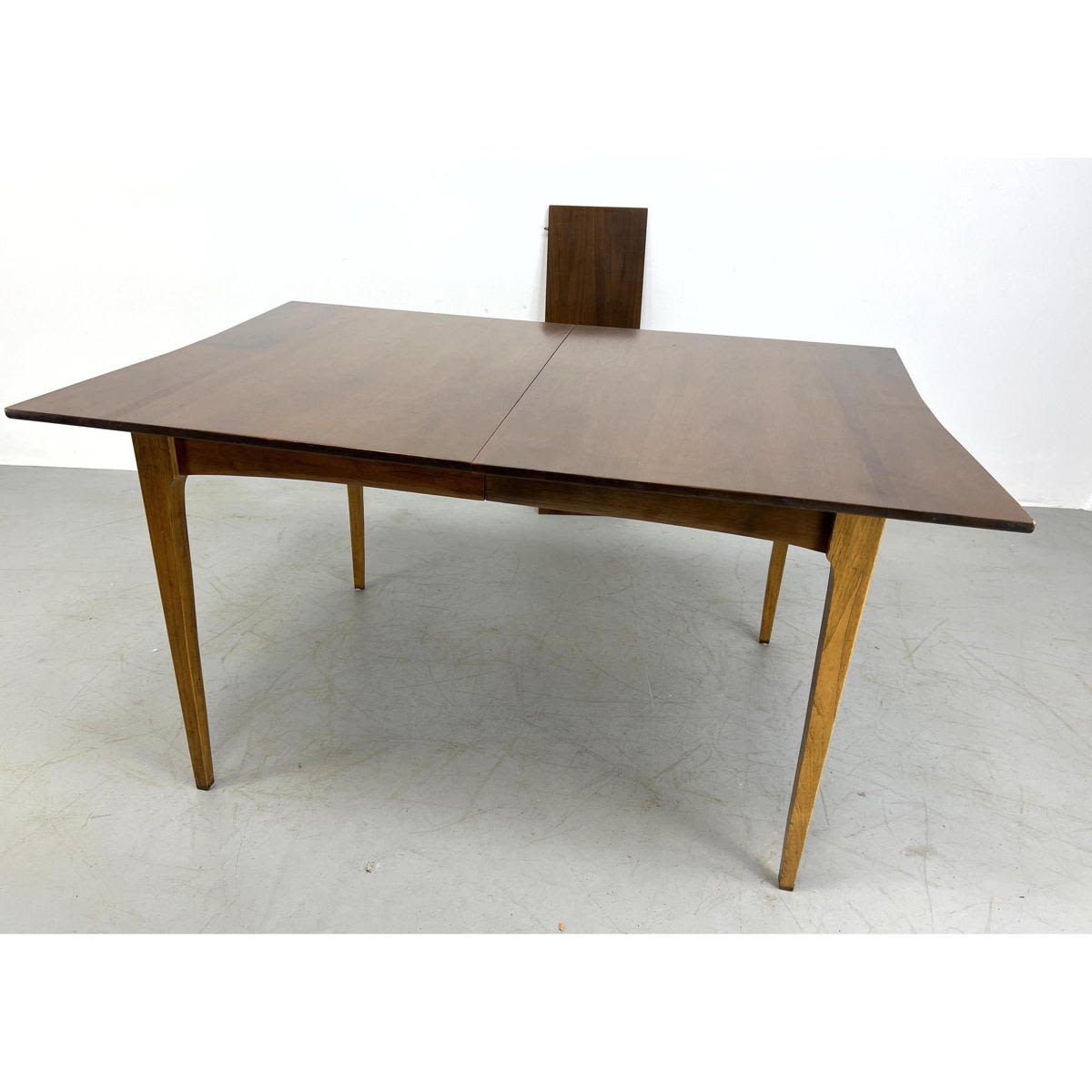 Modern dining table with one leave.