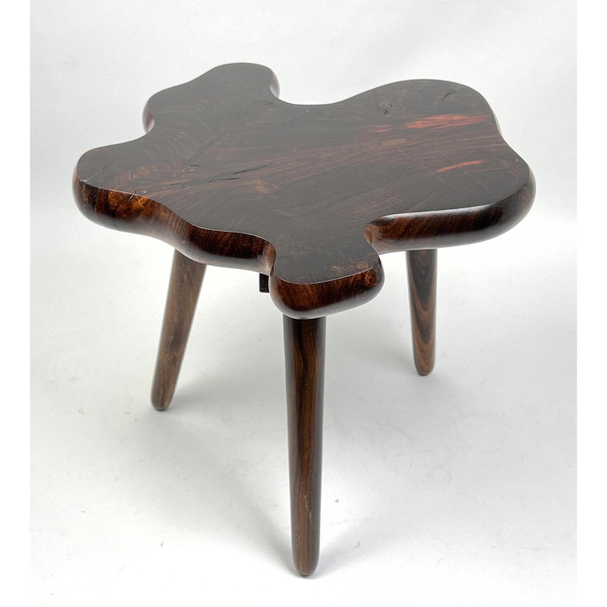 Biomorphic three leg rosewood stool