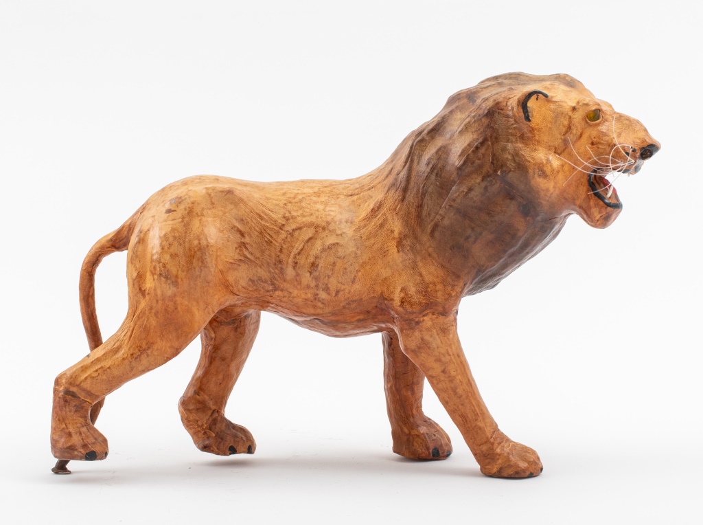 LEATHER-BOUND PROWLING LION SCULPTURE