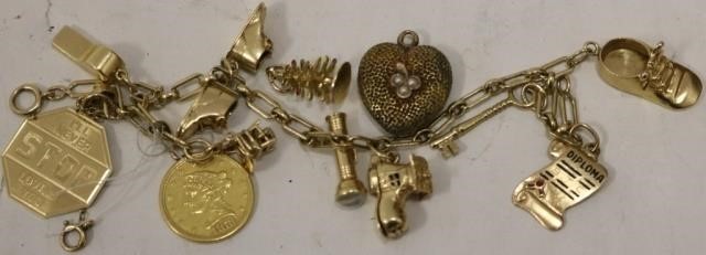 14KT GOLD CHARM BRACELET WITH VARIOUS 2c2a26