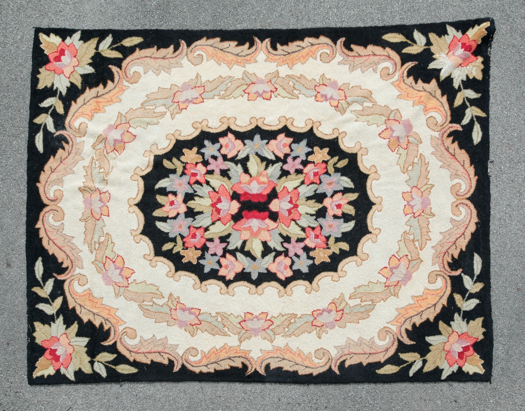 AMERICAN MACHINE MADE HOOKED RUG.