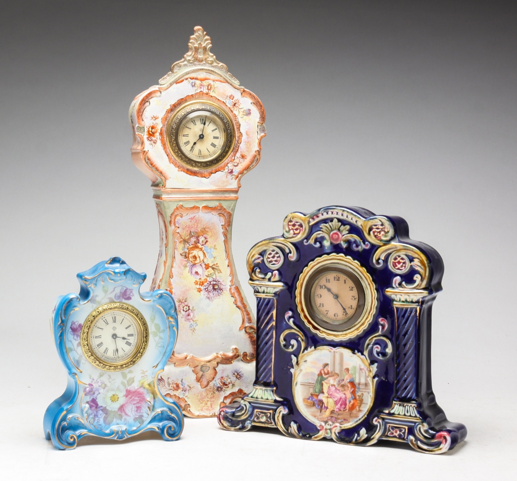 THREE CHINA CASED CLOCKS. Ca. 1900.