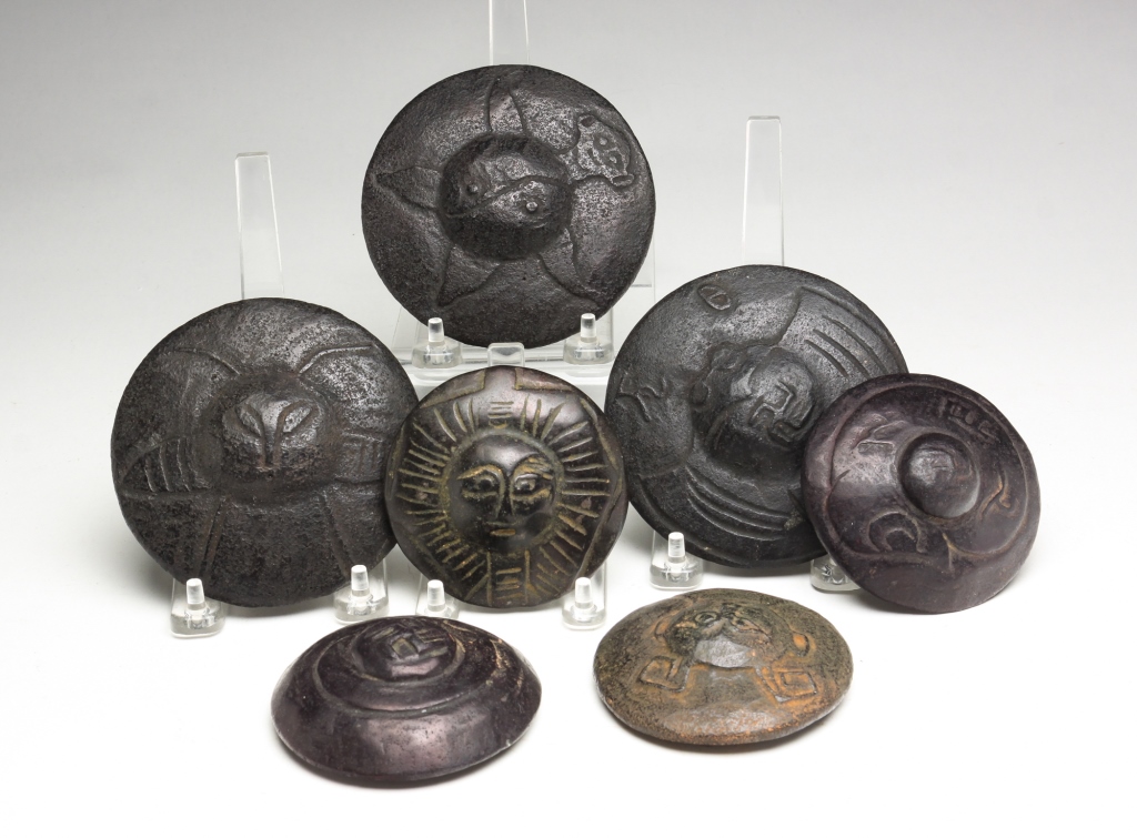 SEVEN ASTROLOGICAL ROUND CARVINGS.