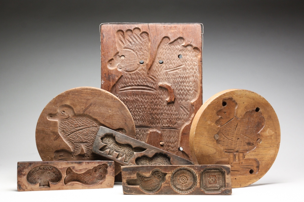 SIX CARVED WOODEN MOLDS. Early