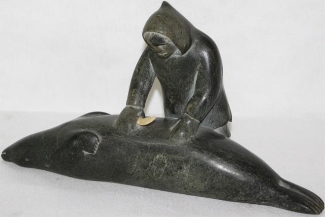 INUIT STONE CARVING DEPICTING A