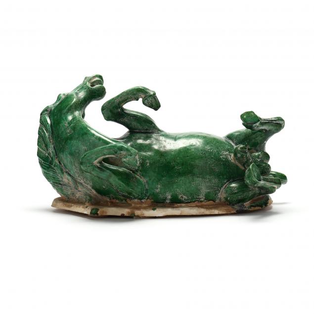 A CHINESE STYLE GREEN GLAZED HORSE