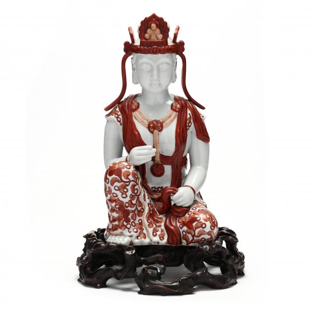 A PORCELAIN SEATED GUANYIN SCULPTURE 2c515c