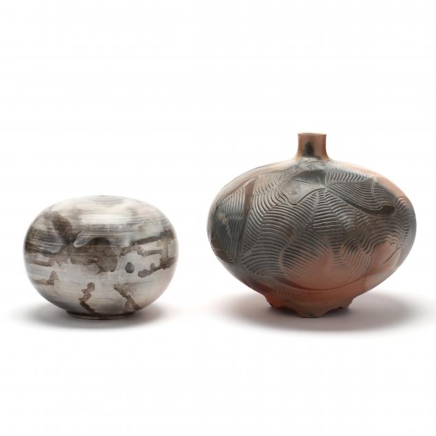 TWO SIGNED RAKU FIRED POTS A round