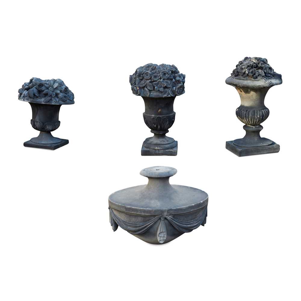 GROUP OF THREE CARVED STONE URNS
LATE