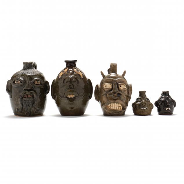 FIVE SOUTHERN FOLK POTTERY FACE JUGS