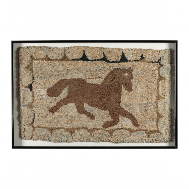 FRAMED HOOKED RUG OF A HORSE With