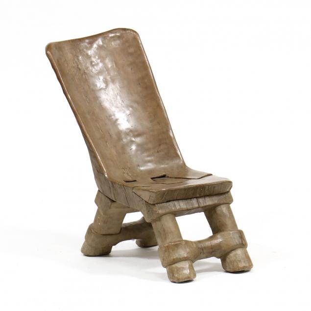 UNUSUAL TRIBAL CARVED WOOD FOLDING CHAIR