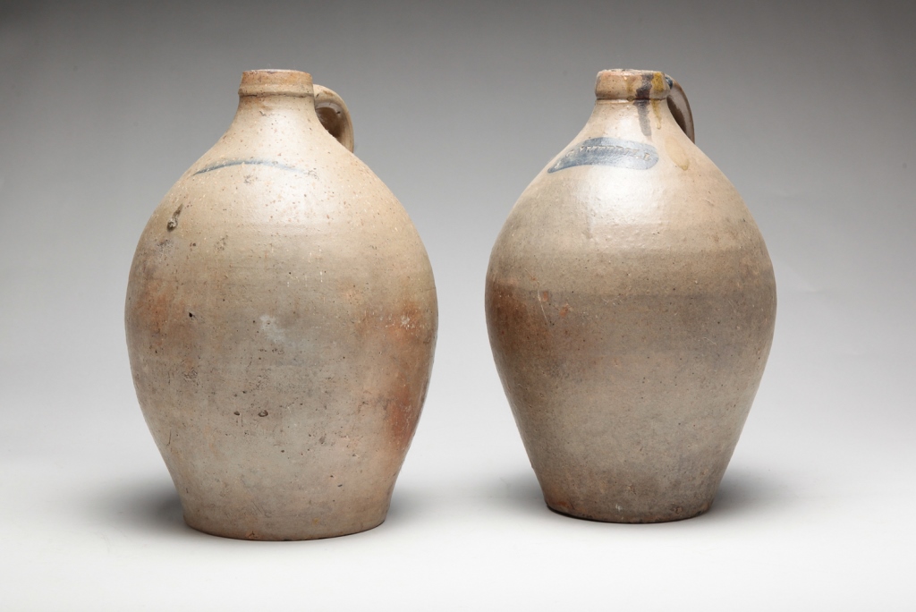 TWO AMERICAN STONEWARE JUGS. Ca. 1840s.