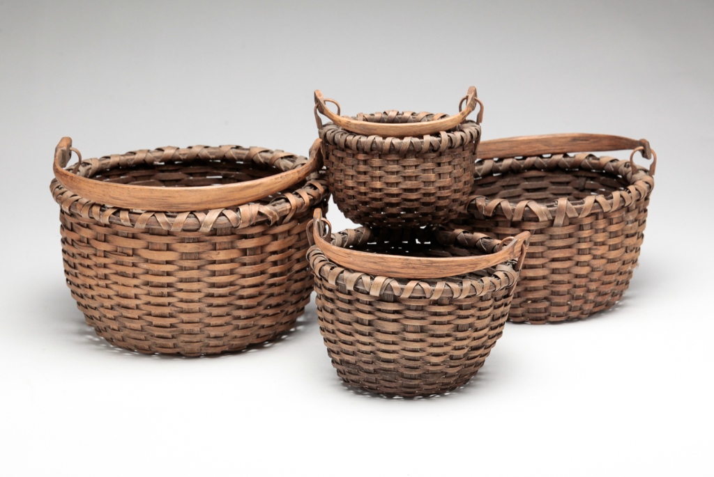 FOUR AMERICAN NESTING BASKETS.