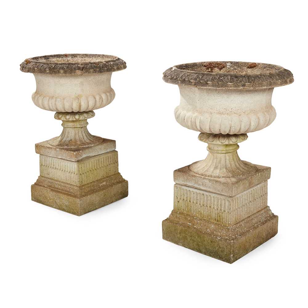 PAIR OF COMPOSITION STONE URNS