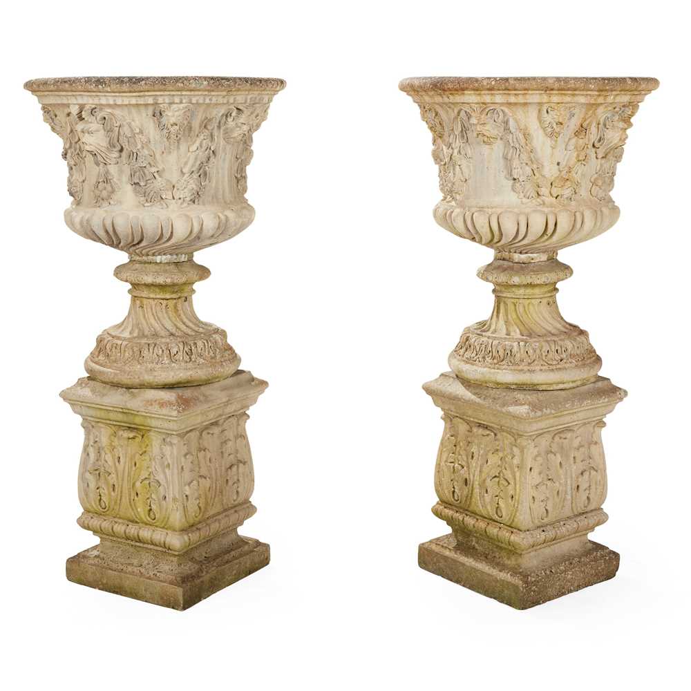 PAIR OF COMPOSITION STONE URNS