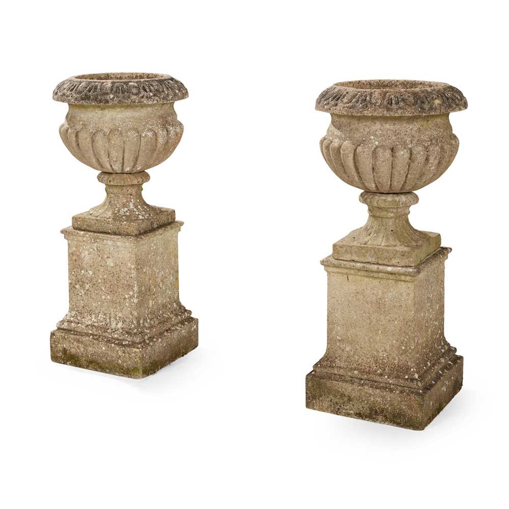 PAIR OF COMPOSITION STONE URNS