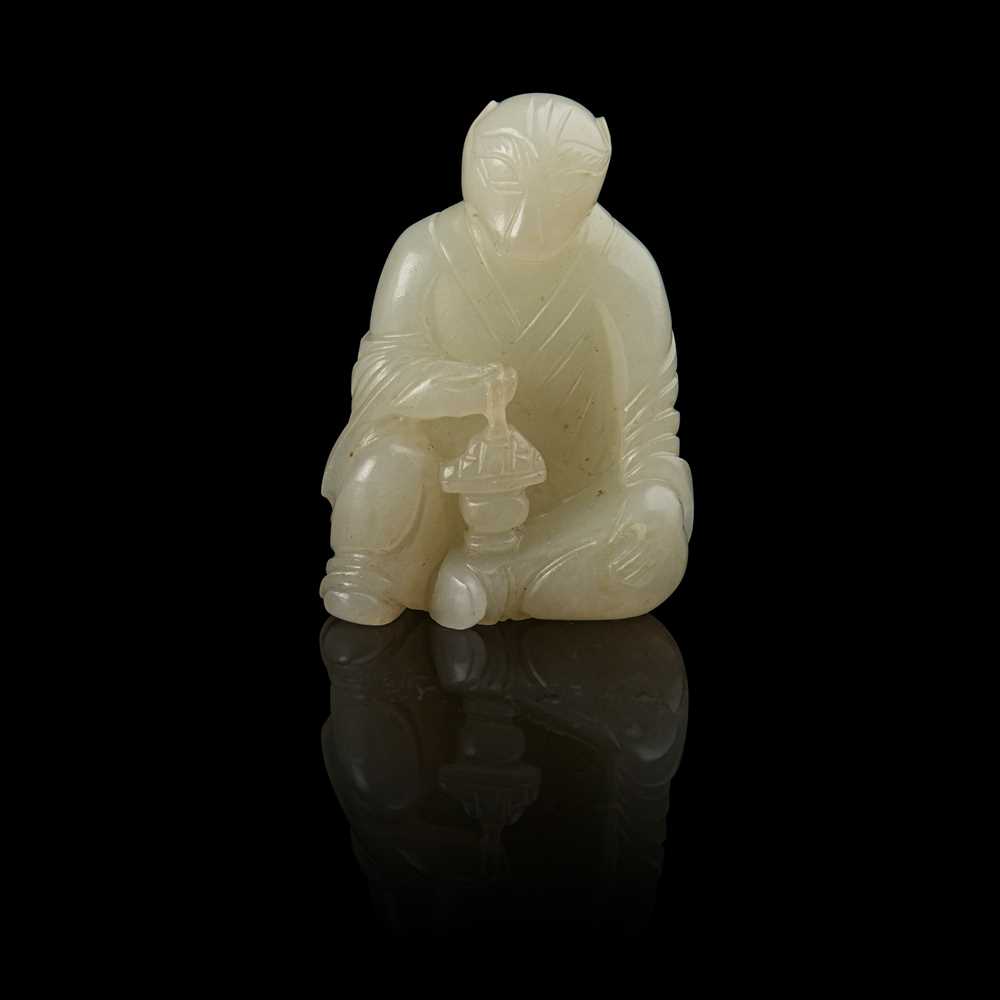 WHITE JADE CARVING OF A TIGER DEITY
QING