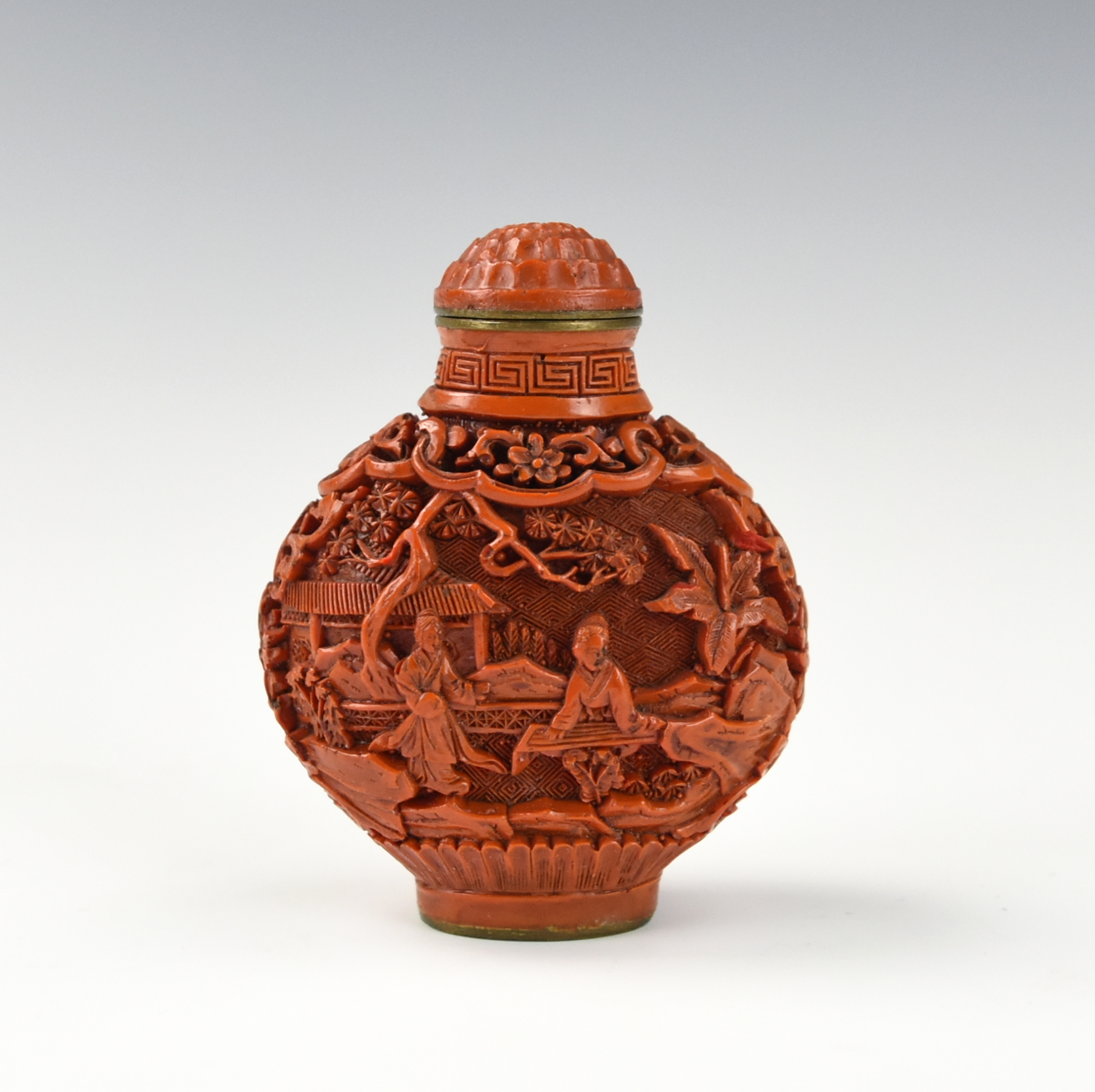 CHINESE CARVED CINNABAR SNUFF BOTTLE,