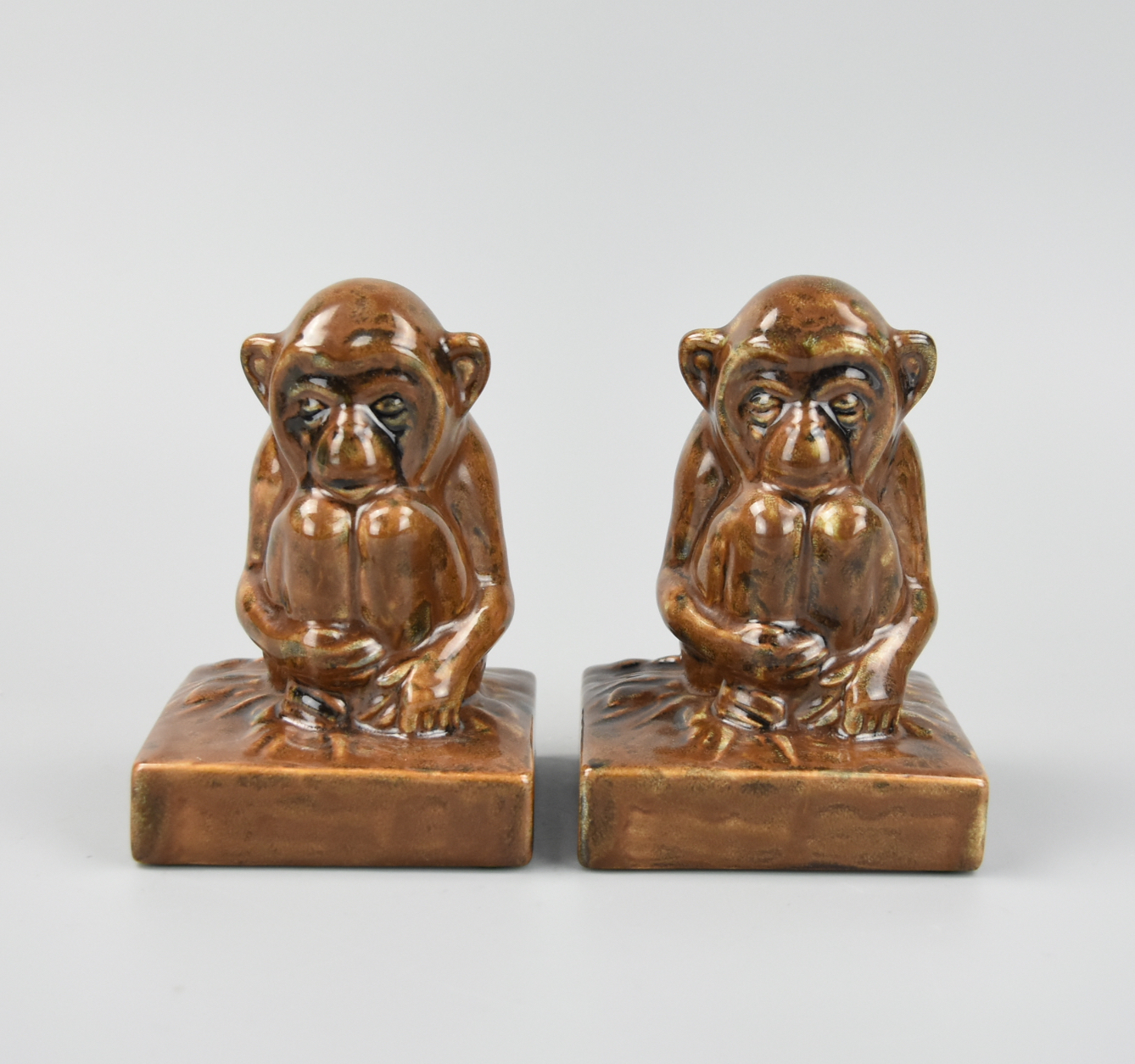 A PAIR OF ROOKWOOD FIGURAL MONKEY