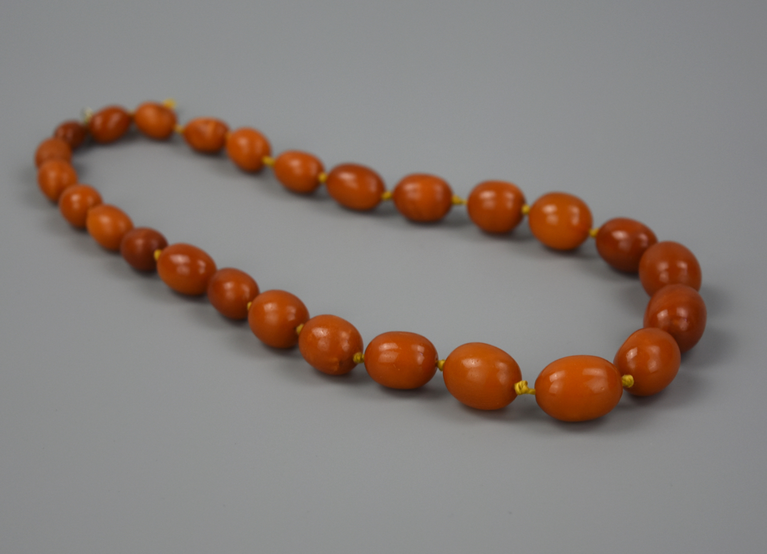 A CHINESE 27 BEED BEESWAX NECKLACE
