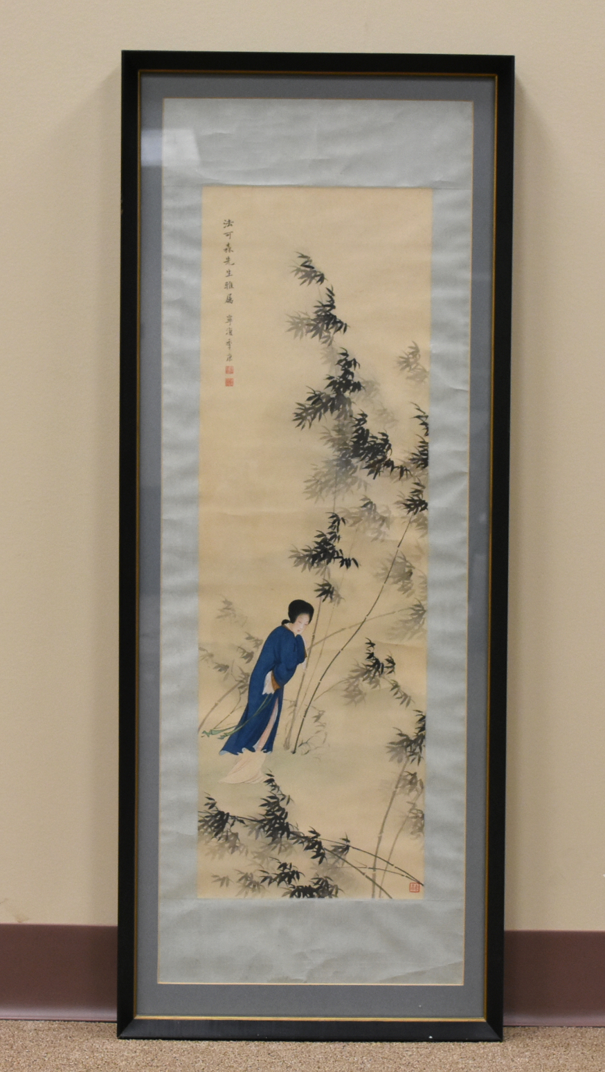 A SCROLL PAINTING OF A WOMAN WALKING