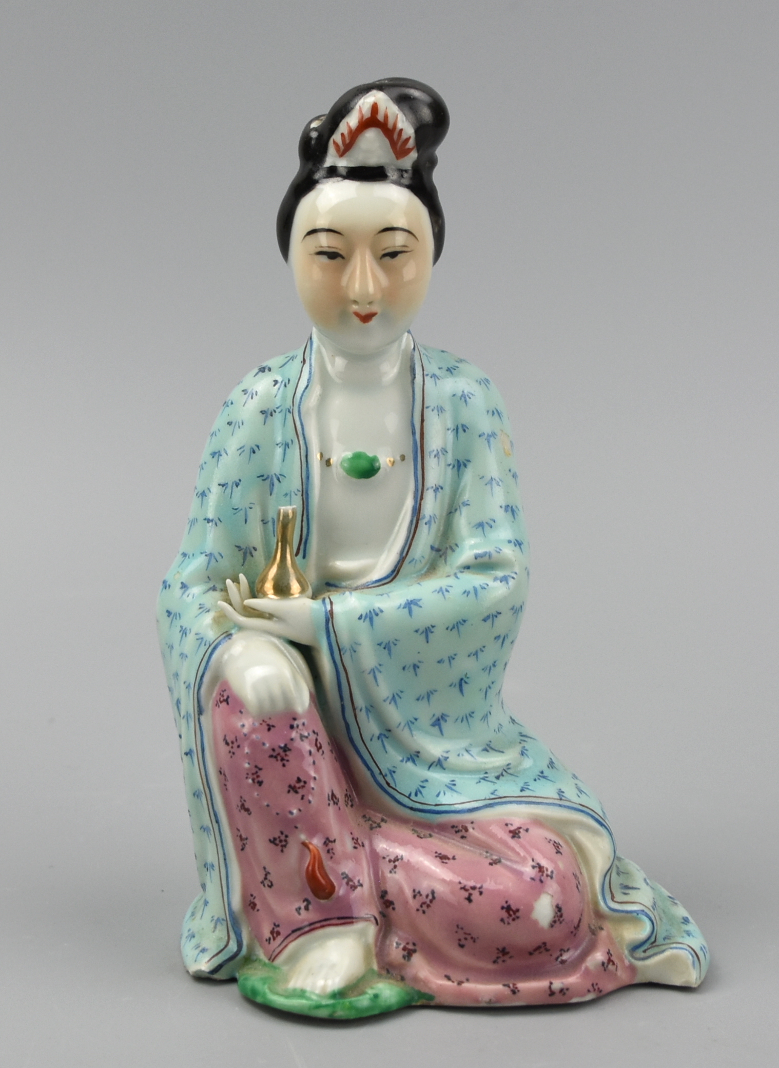 CHINESE SEATED FAMILLE ROSE FIGURE