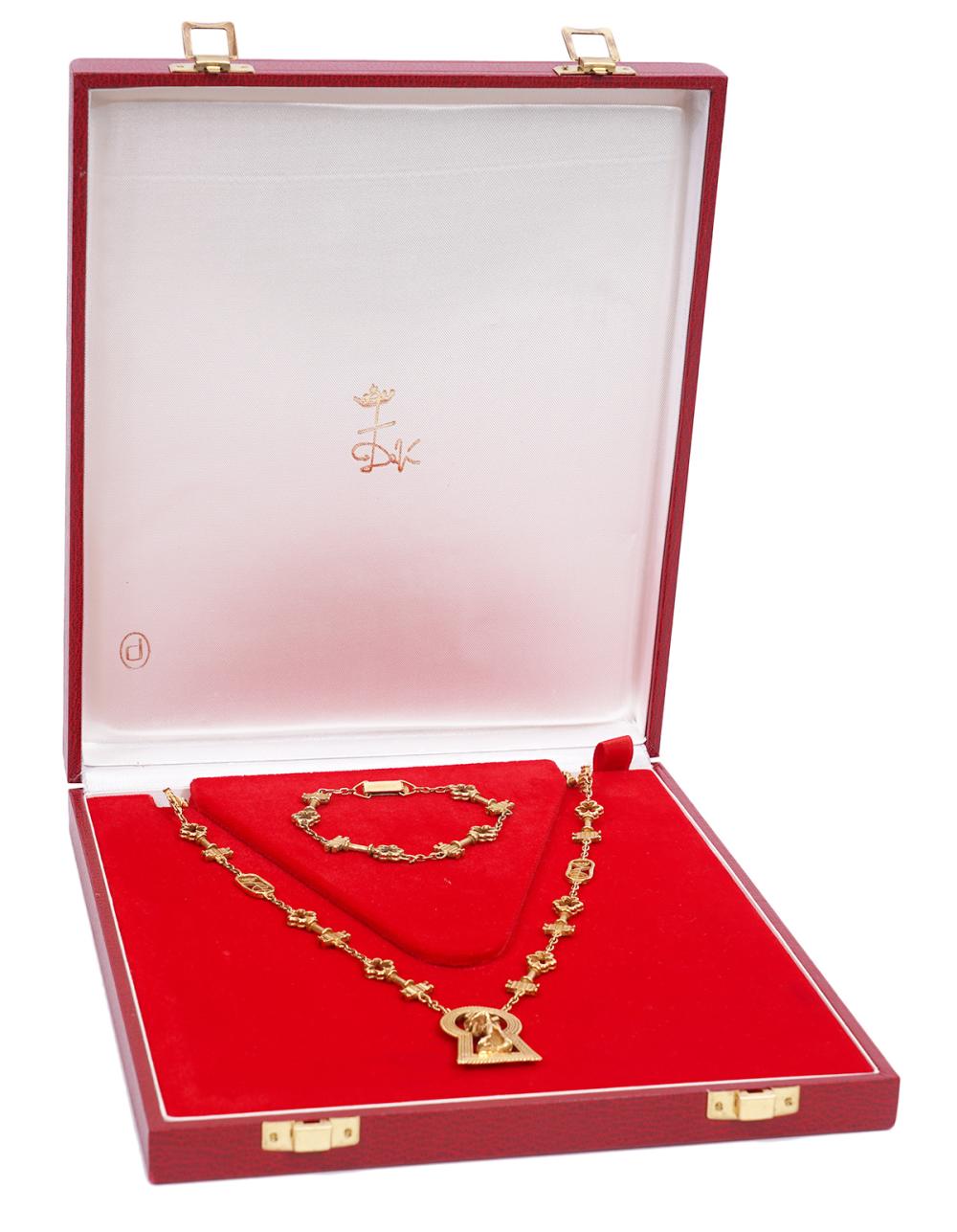 18K YG SALVADOR DALI NECKLACE &