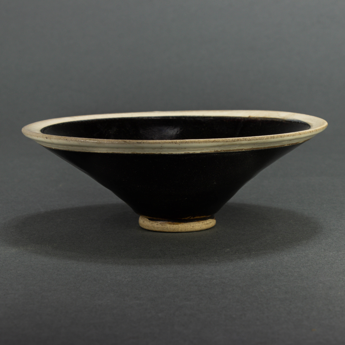 CHINESE BLACK GLAZED WHITE RIM CONICAL