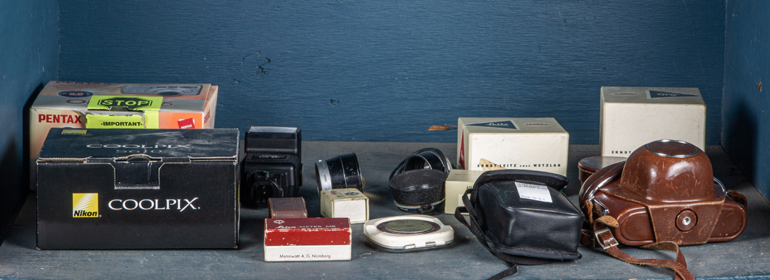 SHELF OF CAMERAS AND CAMERA EQUIPMENT