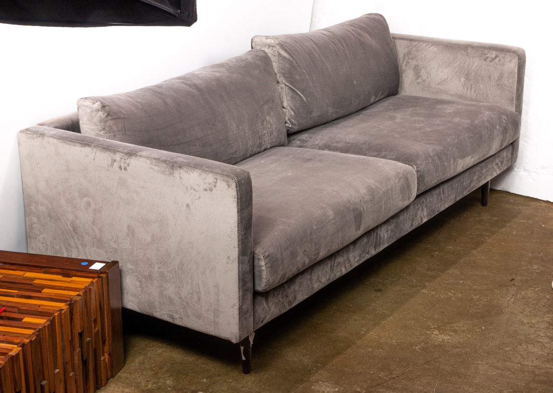 A CONTEMPORARY TWO SEAT SUEDE SOFA 2d1527