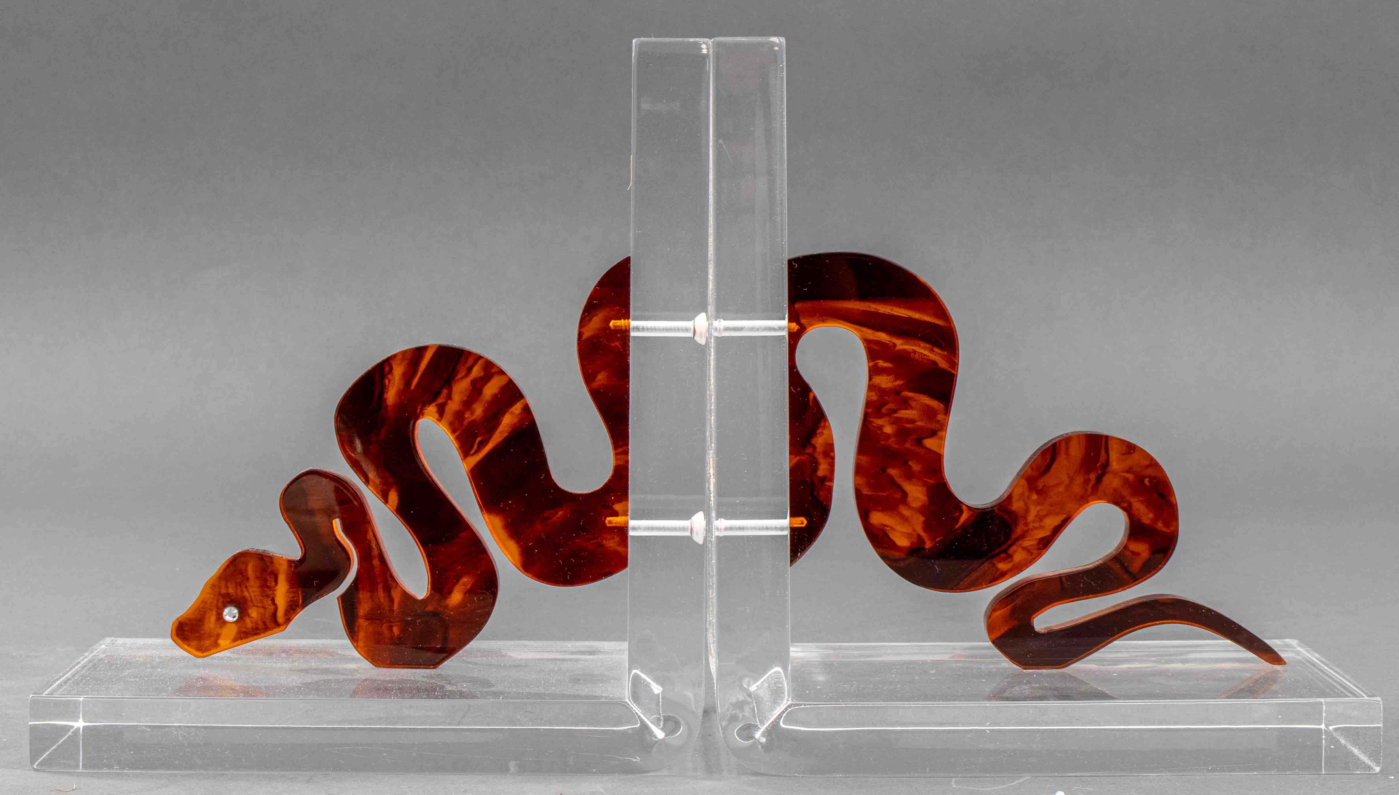 MODERN LUCITE SNAKE BOOKENDS PAIR 2d1d9f