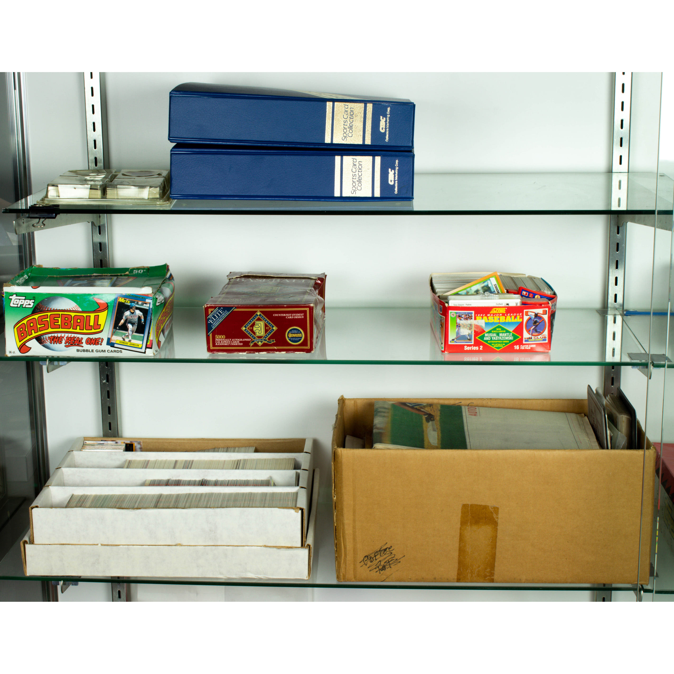 THREE SHELVES OF BASEBALL CARDS