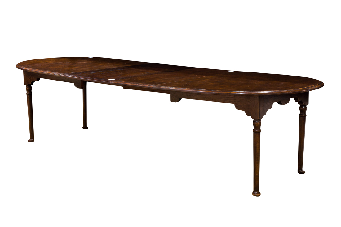 AN ENGLISH OAK DINING TABLE CIRCA