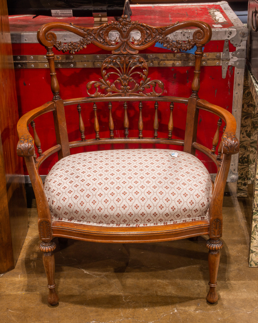 AN ART NOUVEAU WALNUT ARMCHAIR