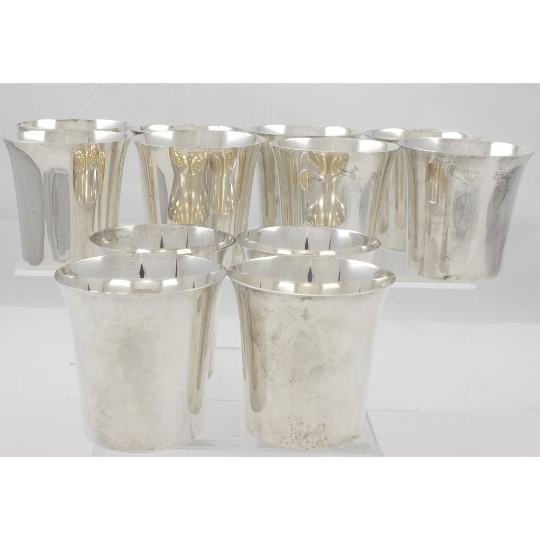 A (SET OF 12) SYMTH STERLING BEAKERS