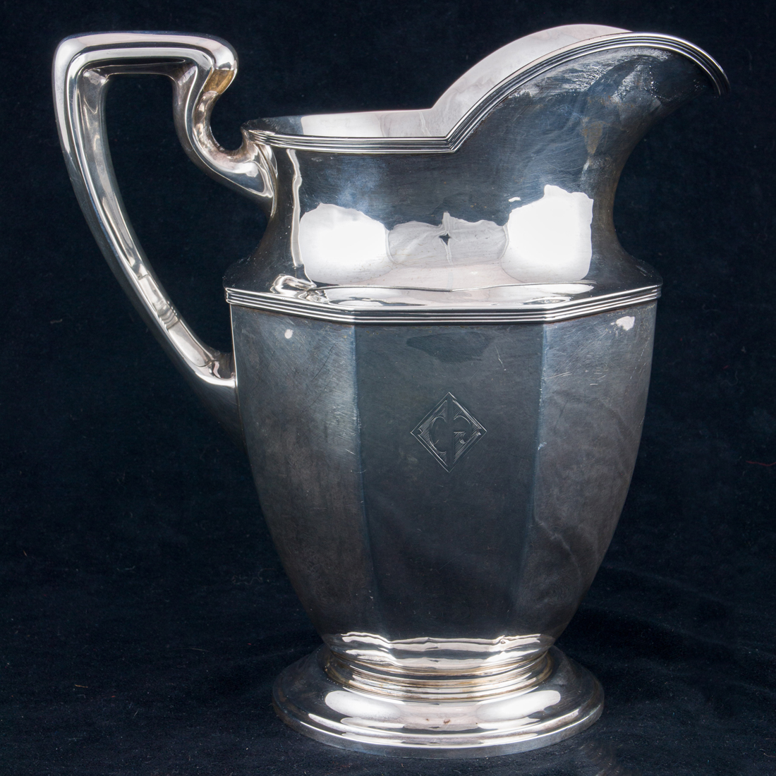 AN ART DECO UNGER BROS STERLING WATER