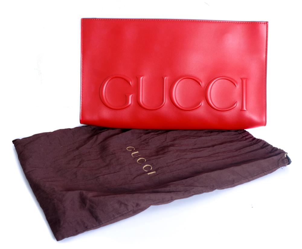 LARGE GUCCI EMBOSSED CLUTCH IN