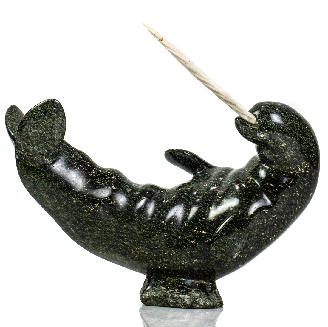 AN INUIT SOAPSTONE CARVING OF A NARWHAL