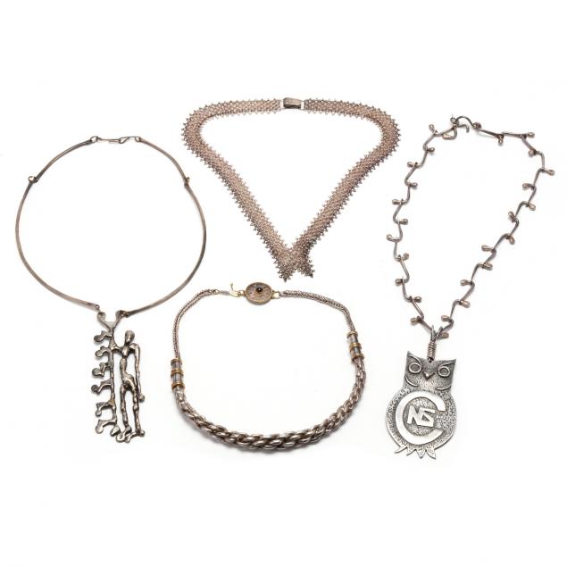 FOUR SILVER NECKLACES To include: