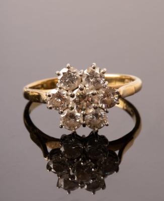 A diamond cluster ring, JWLd, the seven-stone