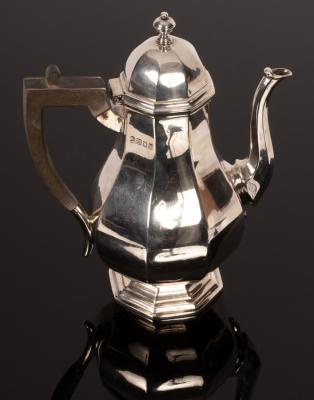 An octagonal pear-shaped silver coffee