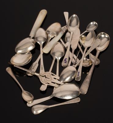 An assortment of silver spoons,
