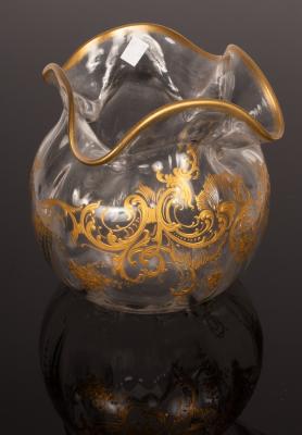 A spherical ribbed glass vase with quatrefoil