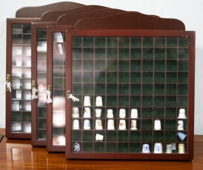 Four thimble display cabinets,