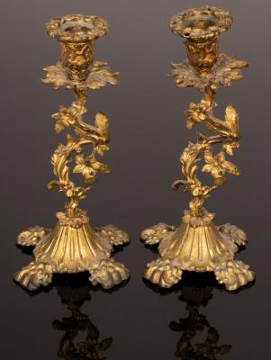 A pair of gilt metal candlesticks with